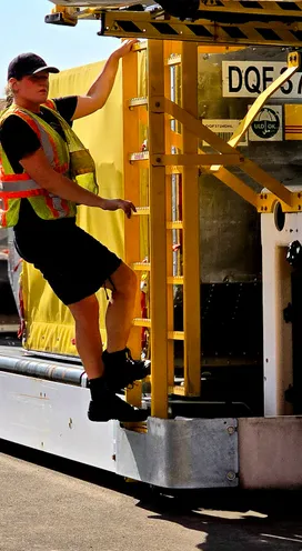 Ground handling team servicing aircraft at airport