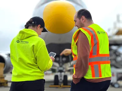 Ground crew member assisting with aircraft operations